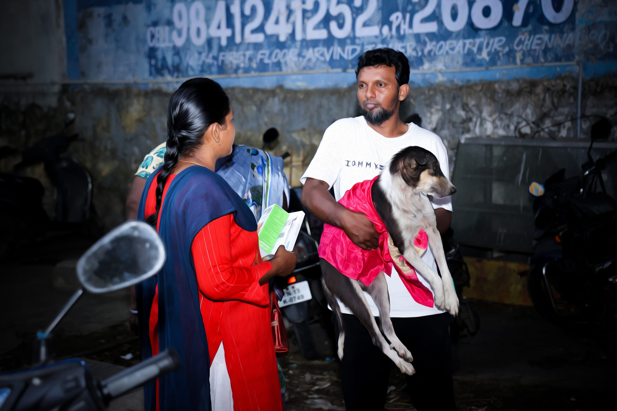 ACAE volunteers help and care for a dog.